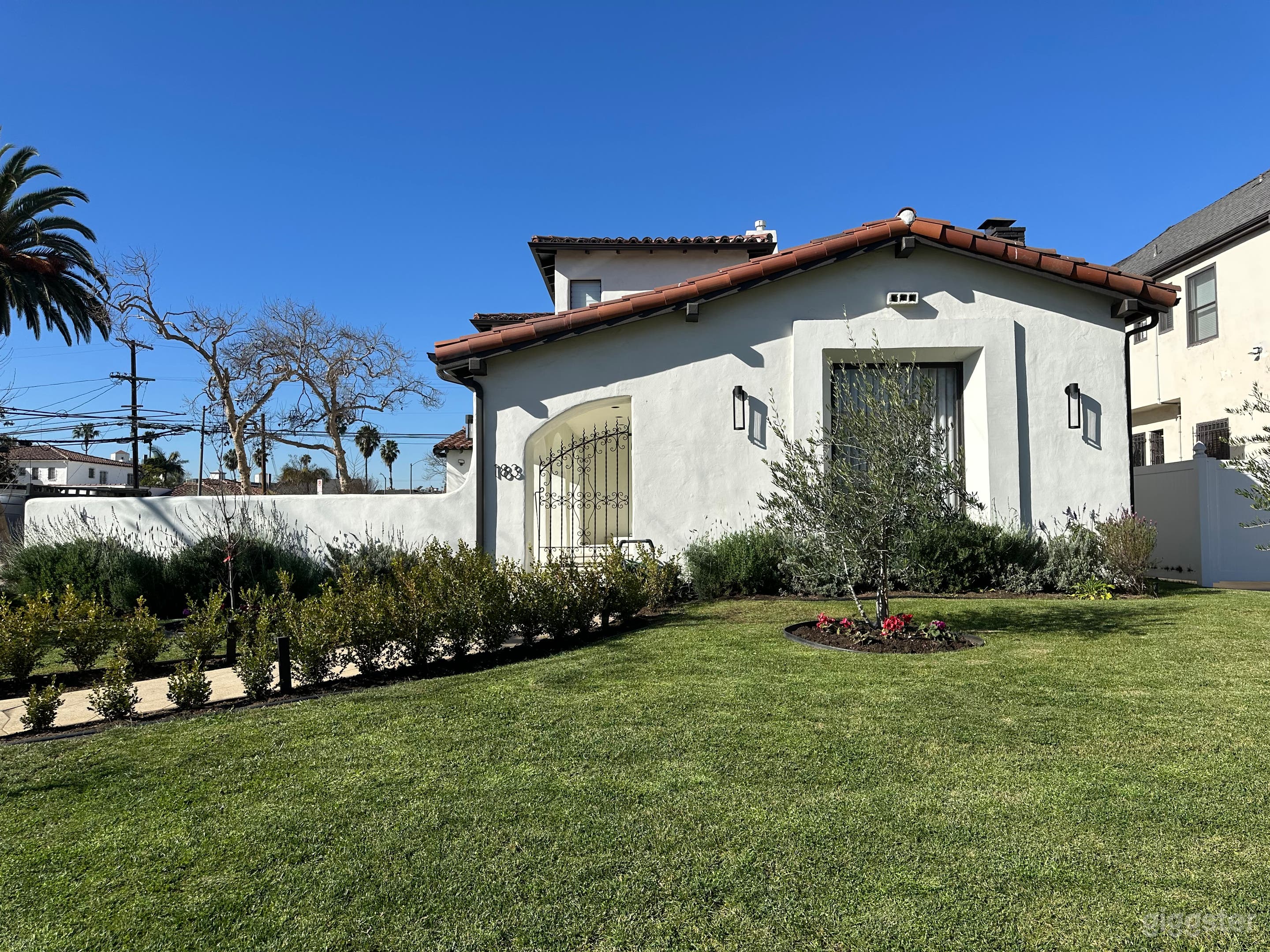 Large Spanish Revival Home (Lush Landscaping) Photo 2