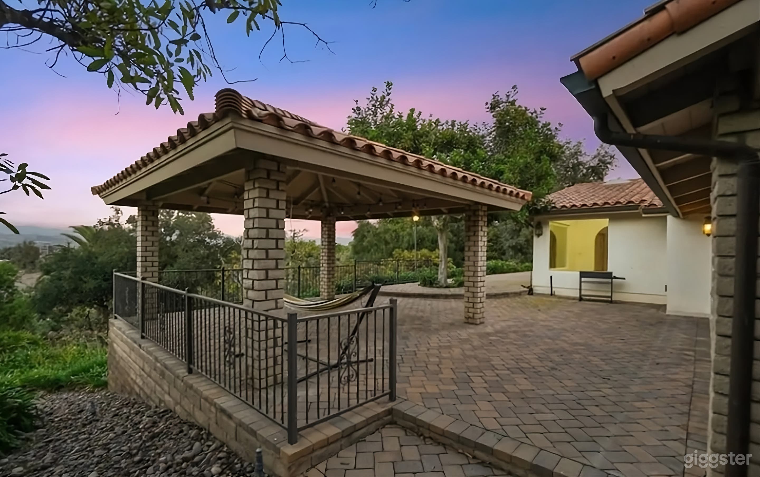 Lush Backyard Paradise with Hillside Views Photo 3