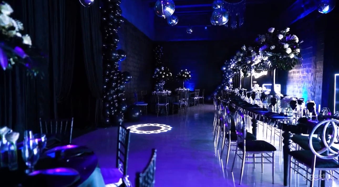 View of main space with elegant dining setup, from ground level.