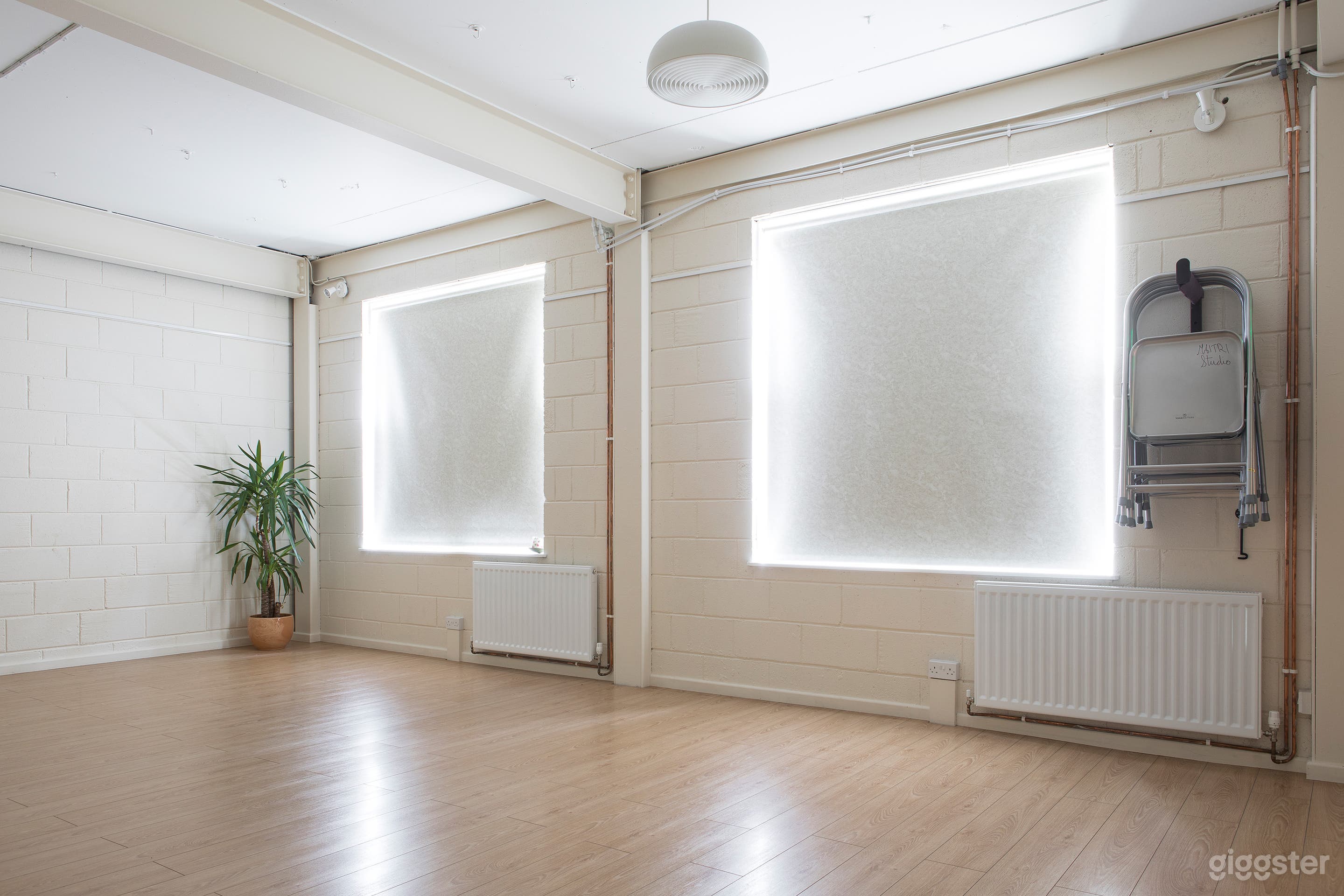 Blinds over windows, metal yoga chairs
