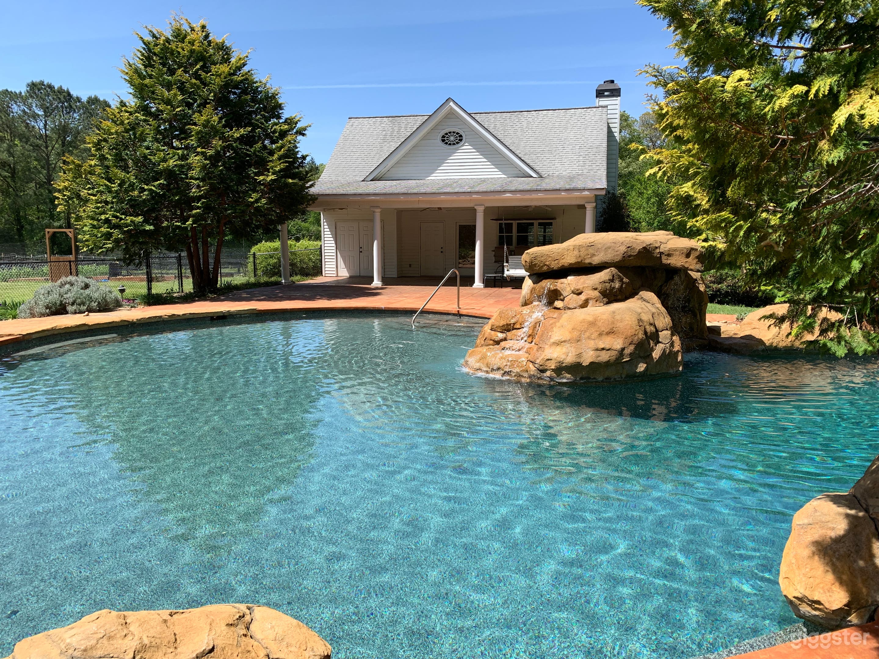 Pool House and Natural Pool with Waterfall Photo 1