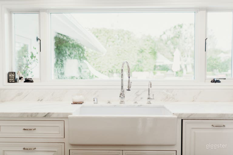  Bright, gourmet kitchen overlooking pool and yard. 