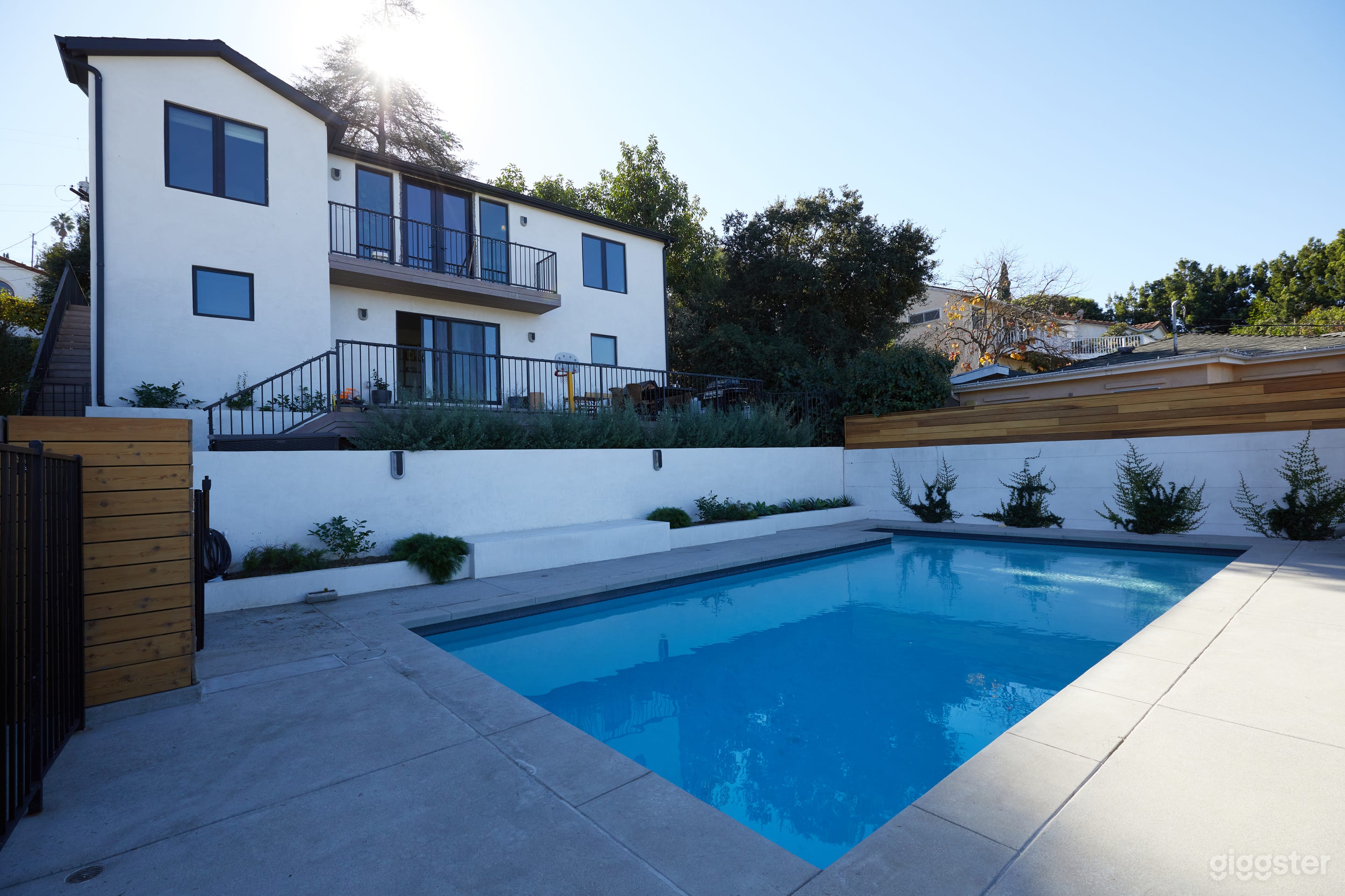 back yard looking at house from pool 