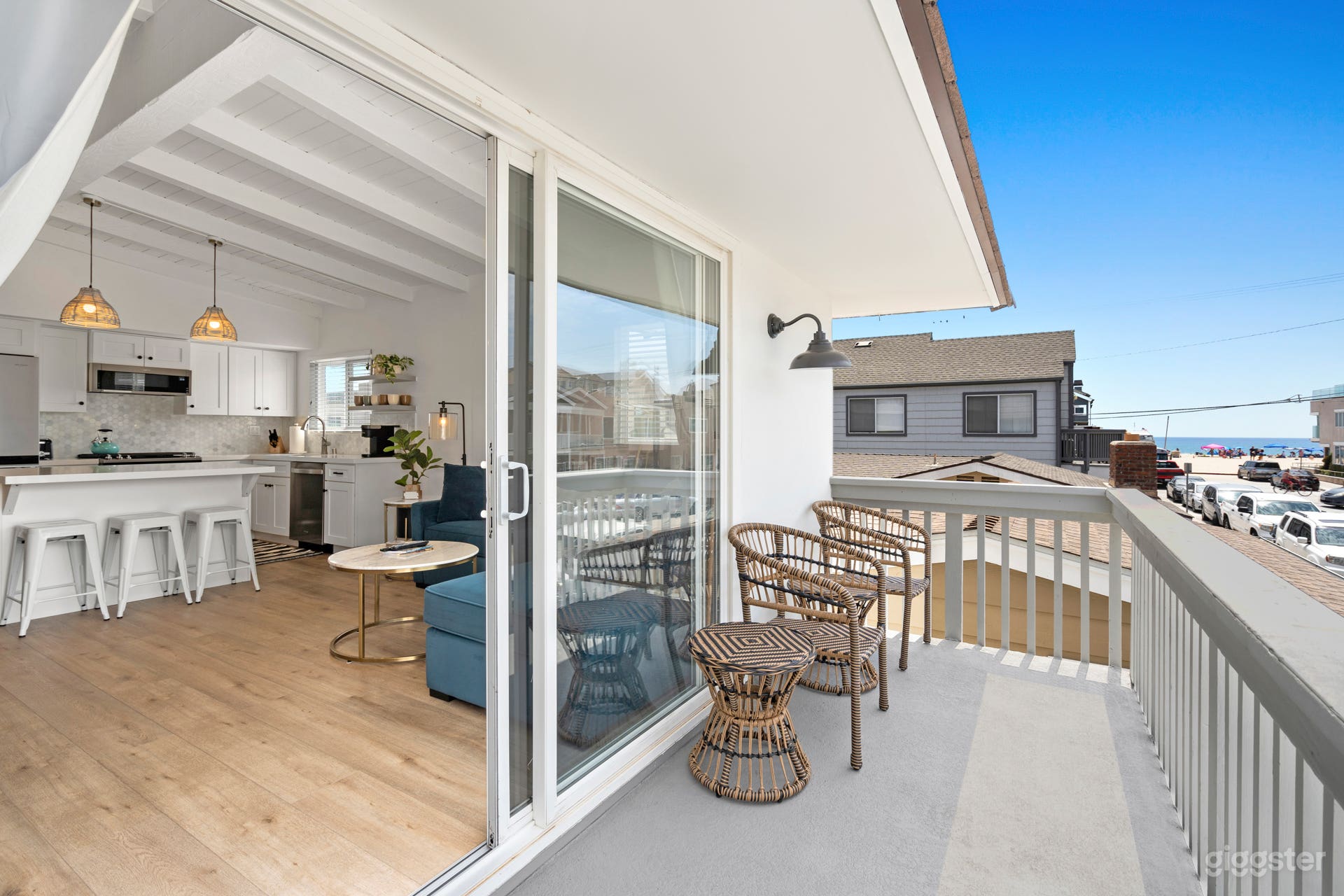 Upstairs Unit living room/kitchen/dining and balcony - view of ocean